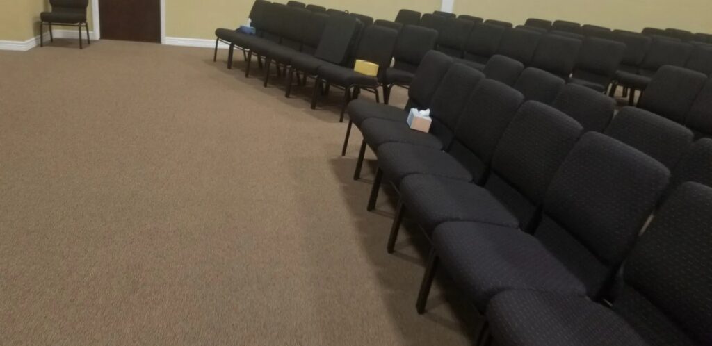 Before photo of church pew restoration project